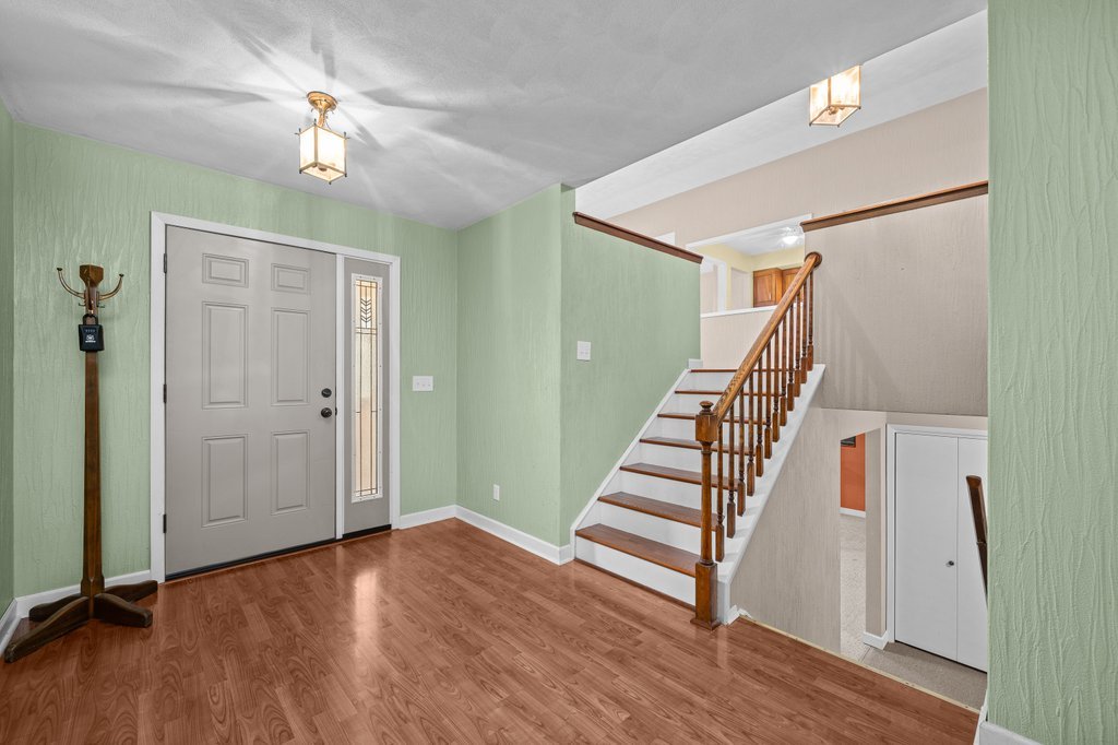 1141 Mark Street Colona, IL 61241 - Photo 6 of 29 wooden floor in an empty room with a window