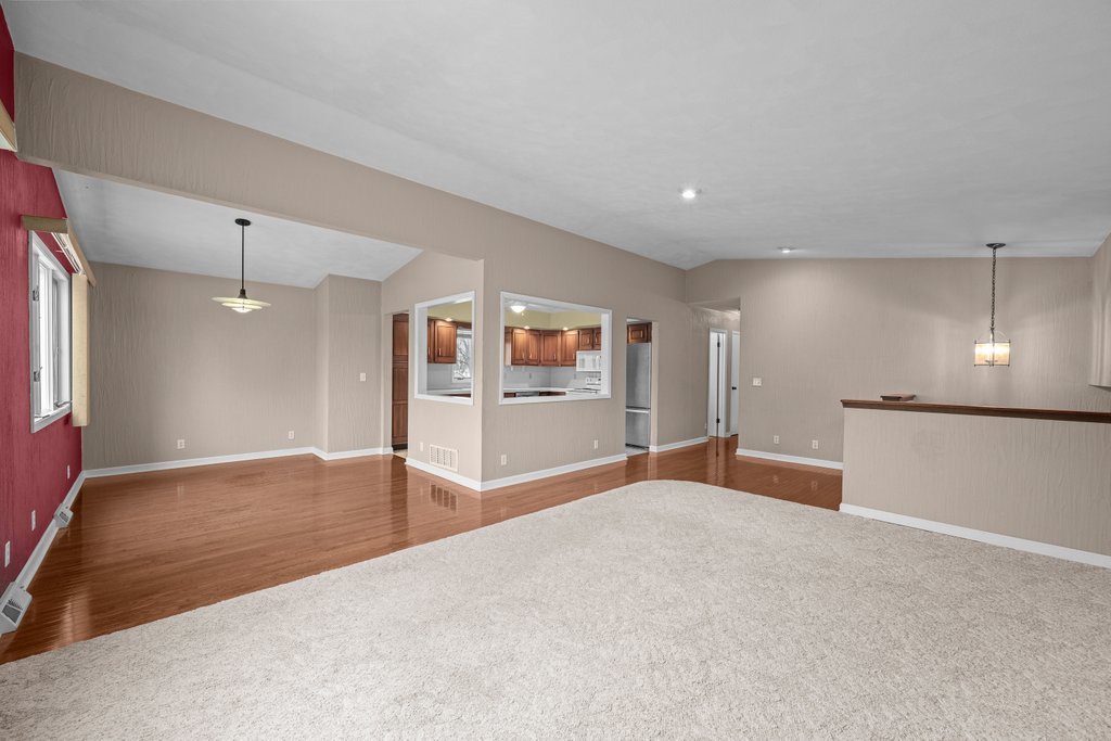 1141 Mark Street Colona, IL 61241 - Photo 9 of 29 a view of a big room with windows and cabinet