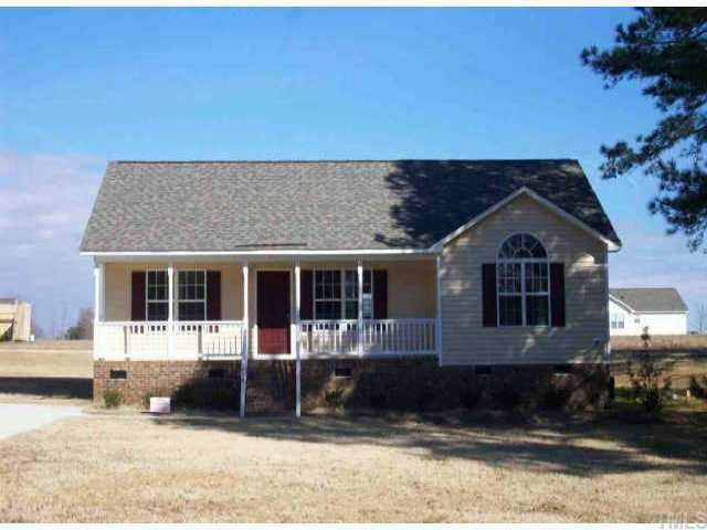 425 Roberts Road Willow Spring, NC 27592 - Photo 1 of 1 a front view of a house with a yard