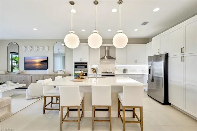 a large kitchen with a table and chairs