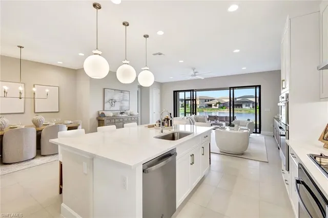 a room with a large island attached withe living room