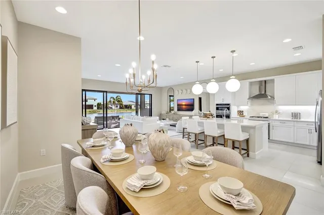 a large kitchen with a table and chairs
