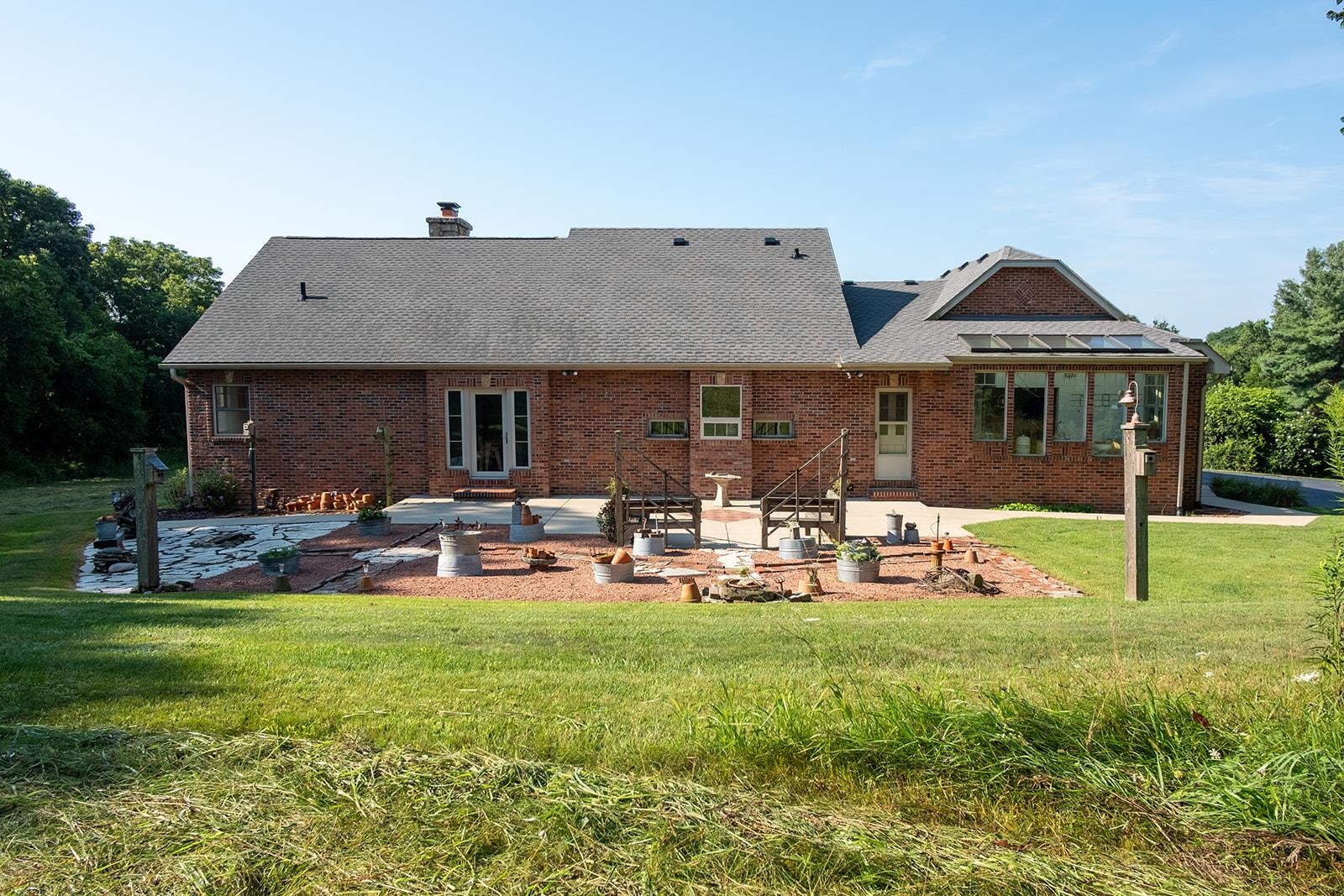 7822 Burr Oak Road Roscoe, IL 61073 - Photo 11 of 53 a front view of a house with backyard and sitting area