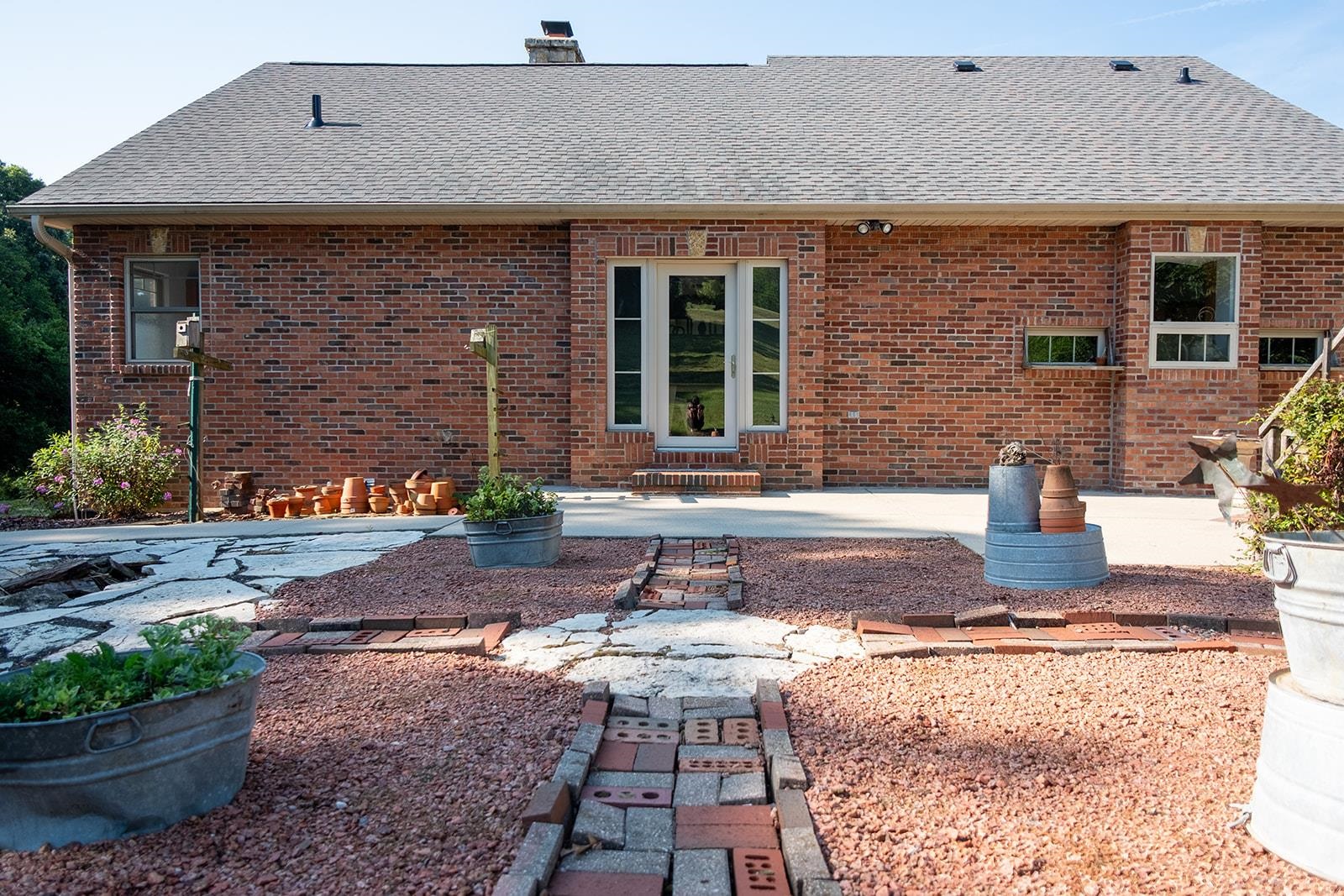 7822 Burr Oak Road Roscoe, IL 61073 - Photo 12 of 53 a front view of a house with garden