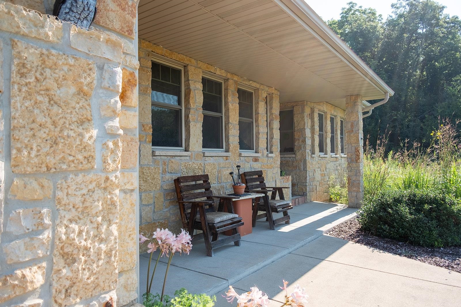 7822 Burr Oak Road Roscoe, IL 61073 - Photo 15 of 53 a view of a house with backyard sitting area and garden