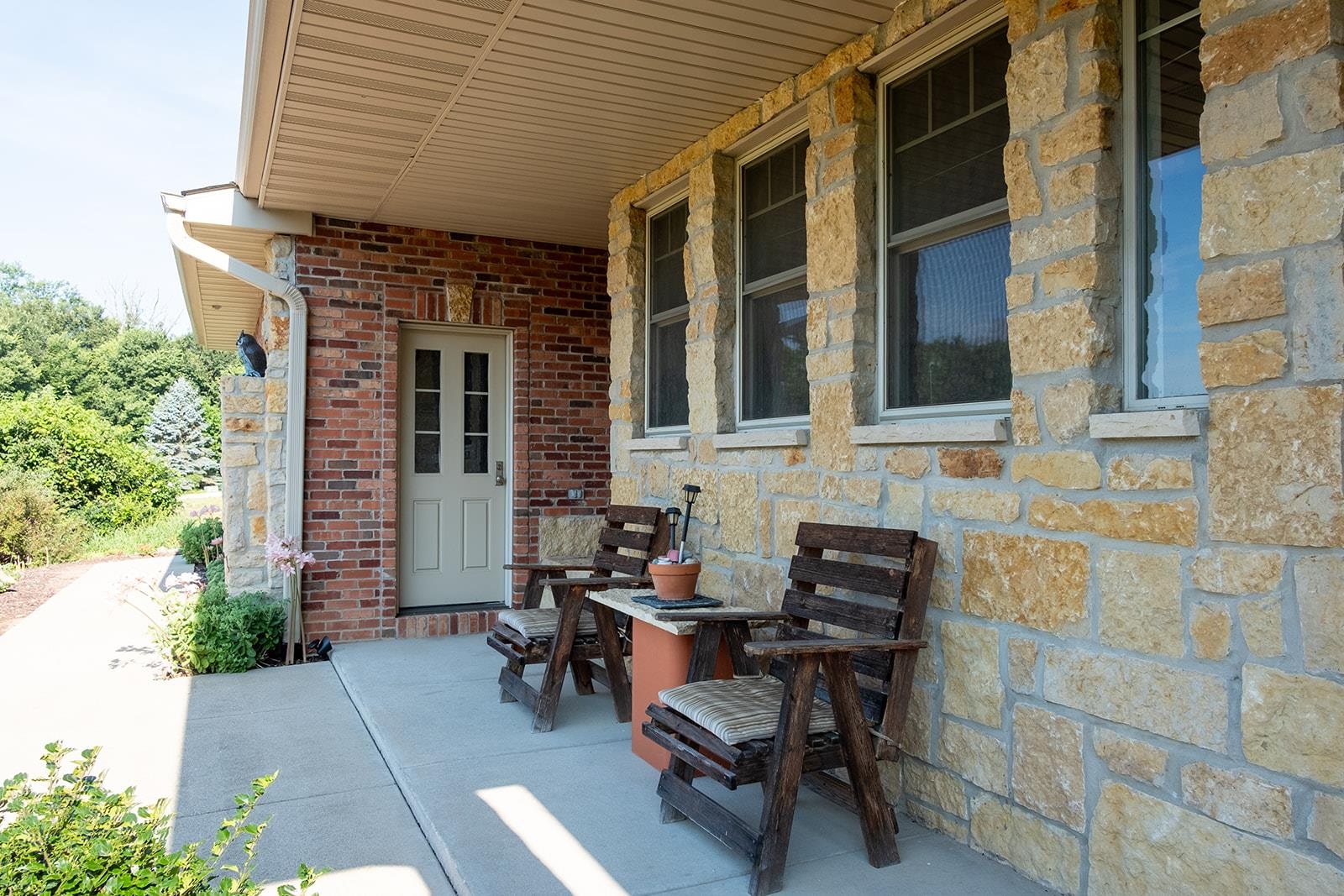 7822 Burr Oak Road Roscoe, IL 61073 - Photo 16 of 53 a view of a patio with a table and chairs