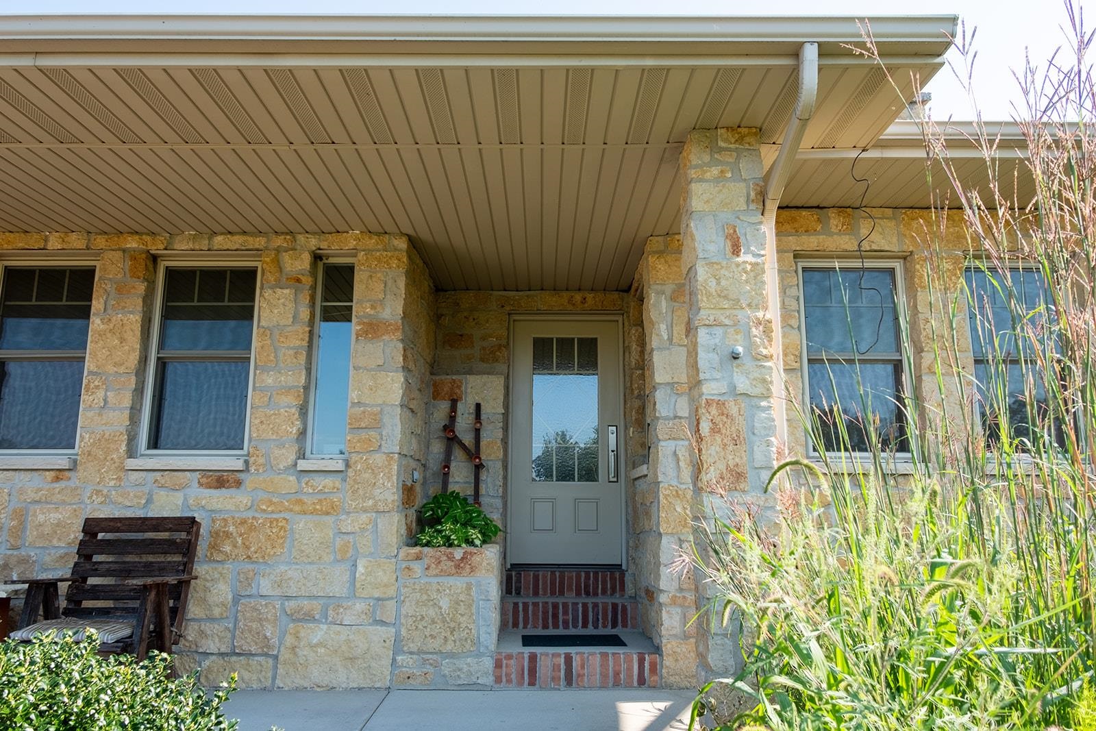 7822 Burr Oak Road Roscoe, IL 61073 - Photo 18 of 53 a front view of a house with a garden
