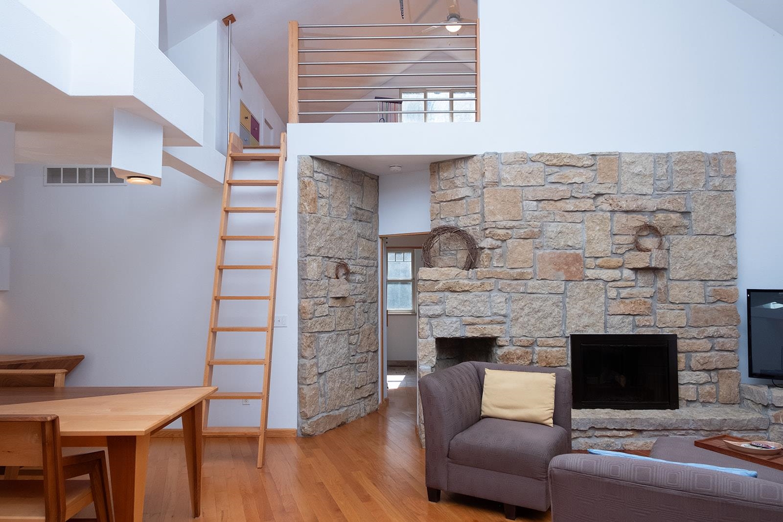 7822 Burr Oak Road Roscoe, IL 61073 - Photo 27 of 53 a living room with furniture and a fireplace
