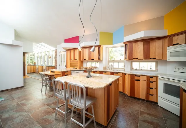 a kitchen with a stove a sink and a refrigerator