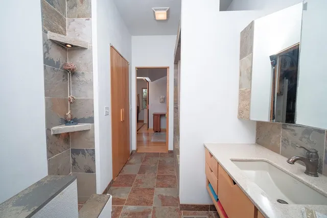 a bed room with a bed and a mirror