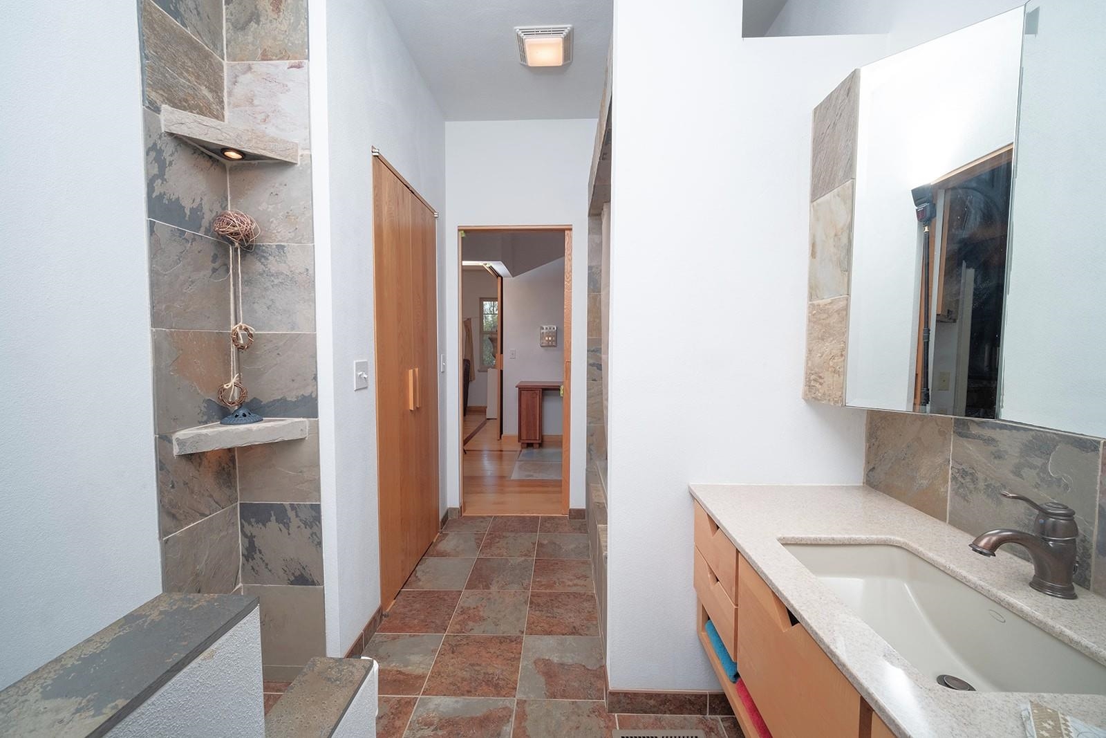 7822 Burr Oak Road Roscoe, IL 61073 - Photo 42 of 53 a bathroom with a sink and a mirror