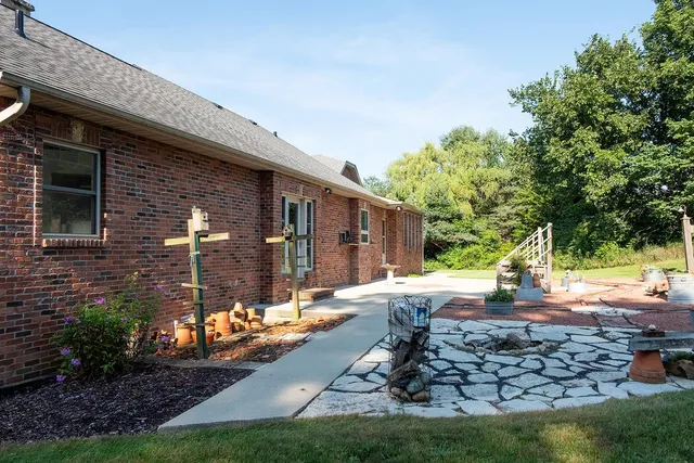 a front view of a house with garden