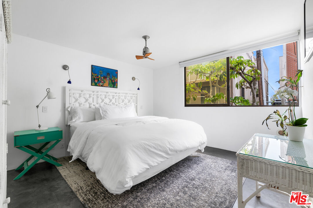 6209 Pacific Avenue, Unit 104 Playa del Rey, CA 90293 - Photo 14 of 18 a bedroom with a bed and a dresser next to a window
