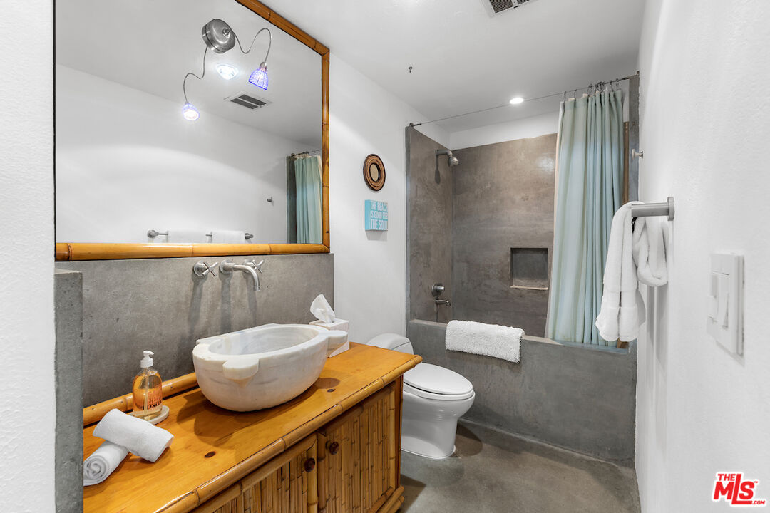 6209 Pacific Avenue, Unit 104 Playa del Rey, CA 90293 - Photo 16 of 18 a bathroom with a sink and a mirror