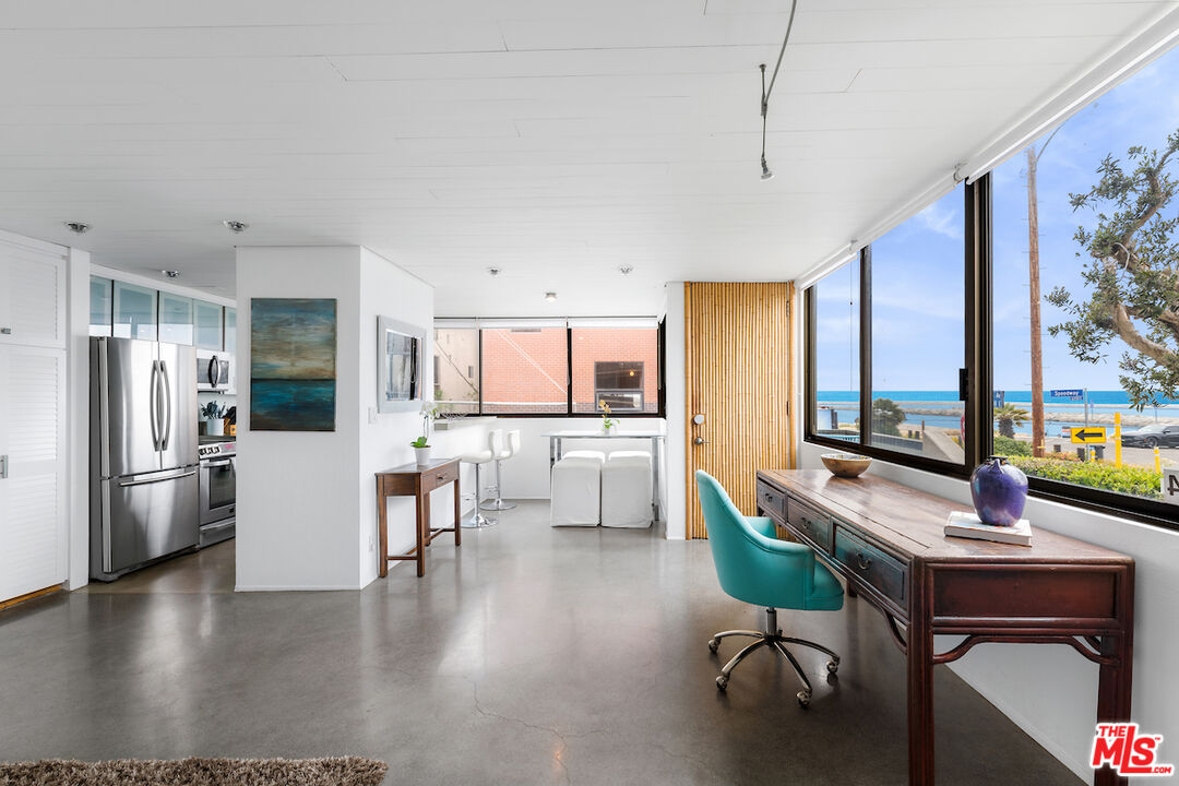 6209 Pacific Avenue, Unit 104 Playa del Rey, CA 90293 - Photo 5 of 18 a living room with furniture and a kitchen view