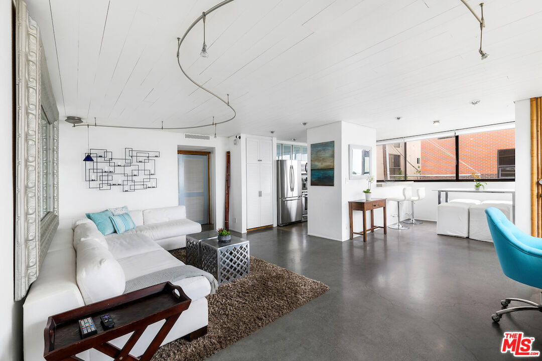 6209 Pacific Avenue, Unit 104 Playa del Rey, CA 90293 - Photo 8 of 18 a living room with furniture and kitchen view
