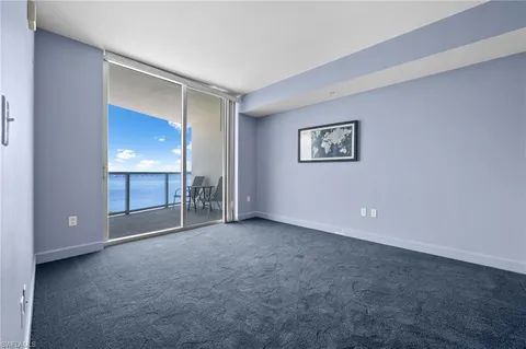 a view of an empty room with a bathroom