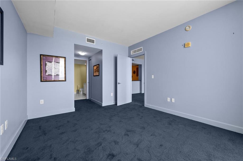 3000 Oasis Grand Boulevard, Unit 906 Fort Myers, FL 33916 - Photo 14 of 21 an empty room with closet