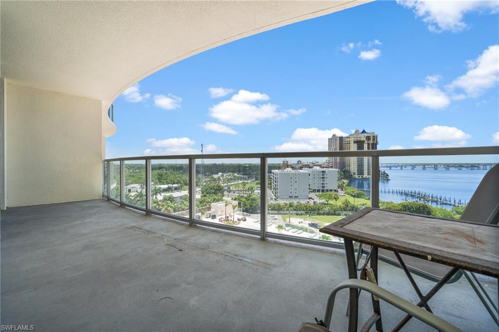 3000 Oasis Grand Boulevard, Unit 906 Fort Myers, FL 33916 - Photo 18 of 21 a view of a chairs and table in a patio