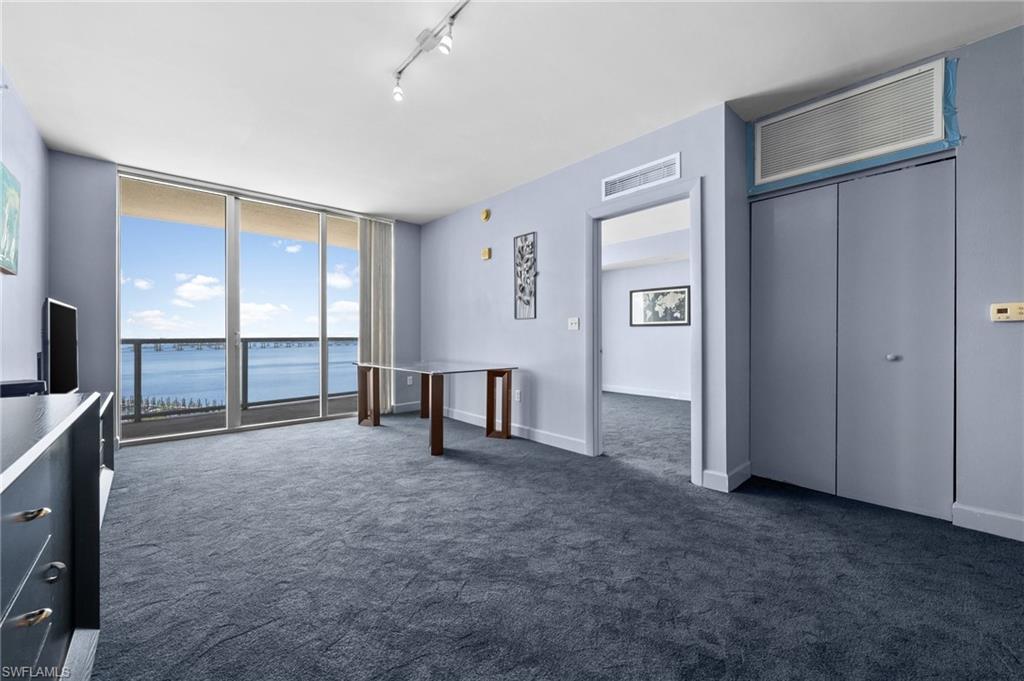 3000 Oasis Grand Boulevard, Unit 906 Fort Myers, FL 33916 - Photo 10 of 21 an empty room with windows and closet