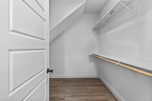 a view of an empty walk in closet