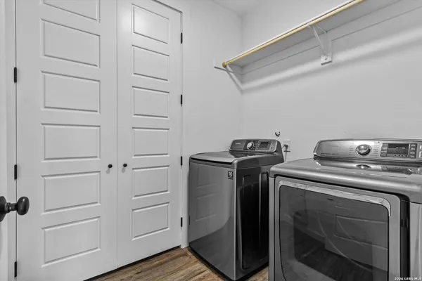 a utility room with washer and dryer