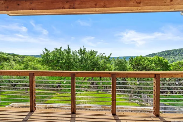 a view of a yard with wooden fence