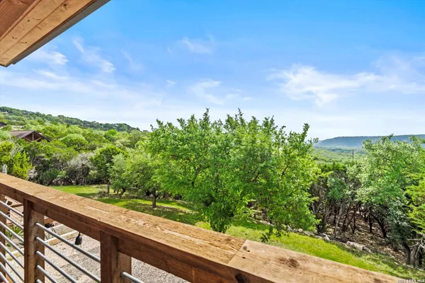 a view of a garden from a balcony