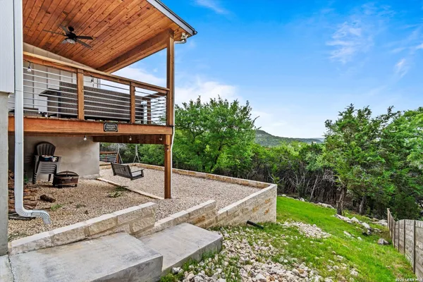 a view of a backyard with sitting area