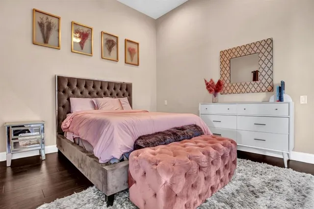 a bedroom with bed and cupboard