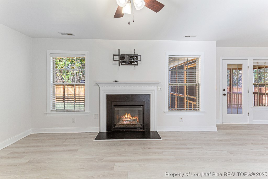 297 Colonist Place Cameron, NC 28326 - Photo 8 of 31 a living room with a fireplace