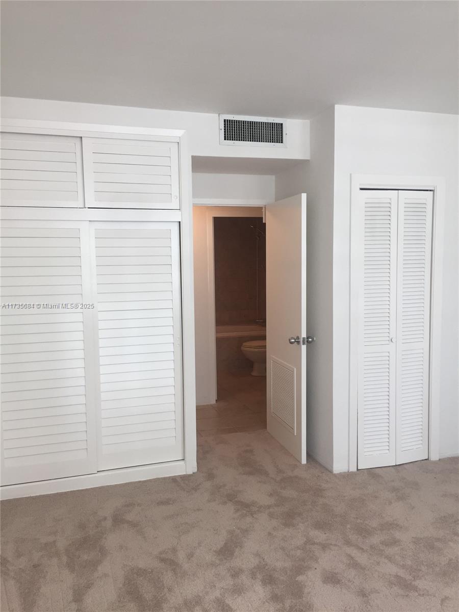1408 Brickell Bay Drive, Unit 917 Miami, FL 33131 - Photo 13 of 18 an empty room with closet