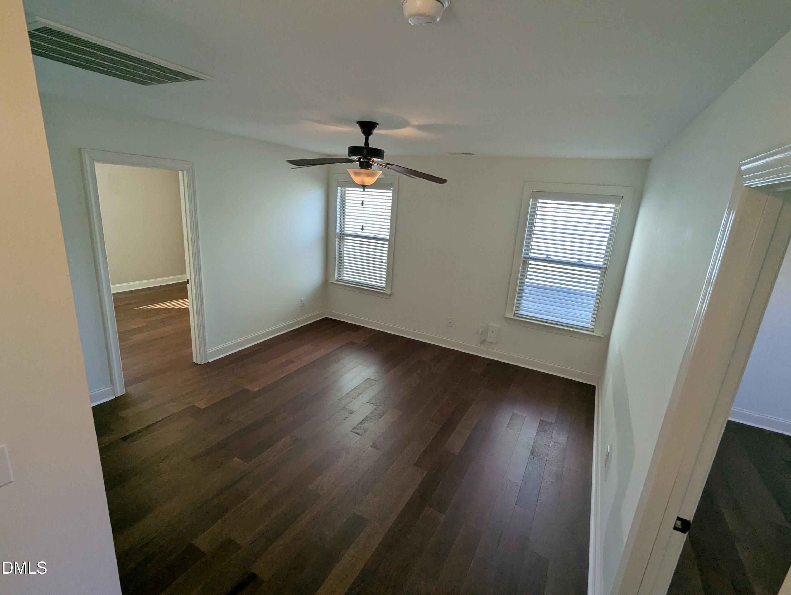 833 Poplar Street Durham, NC 27703 - Photo 11 of 20 wooden floor in an empty room with a window