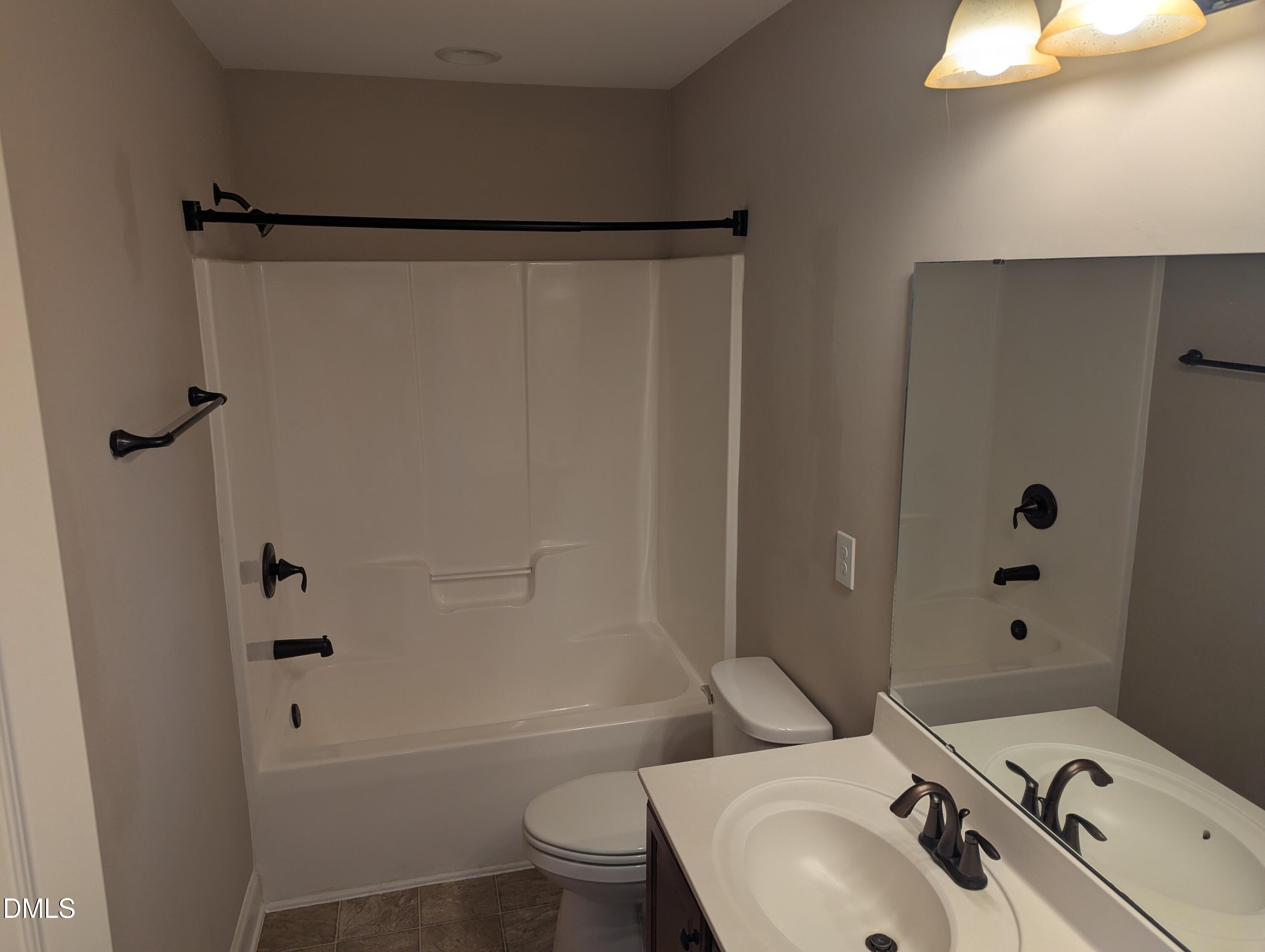 833 Poplar Street Durham, NC 27703 - Photo 12 of 20 a bathroom with a sink toilet and shower