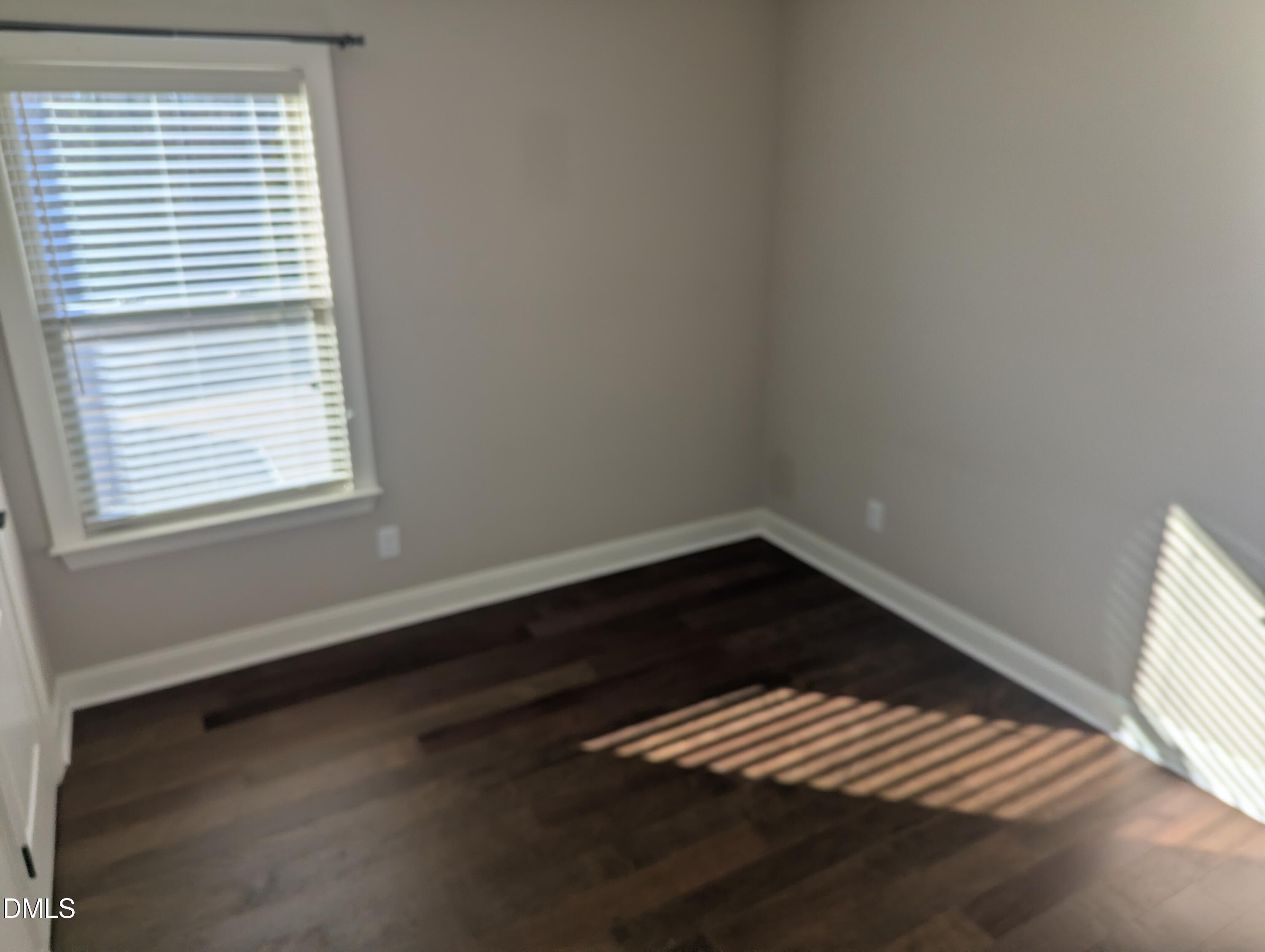 833 Poplar Street Durham, NC 27703 - Photo 14 of 20 a view of wooden floor and windows in a room
