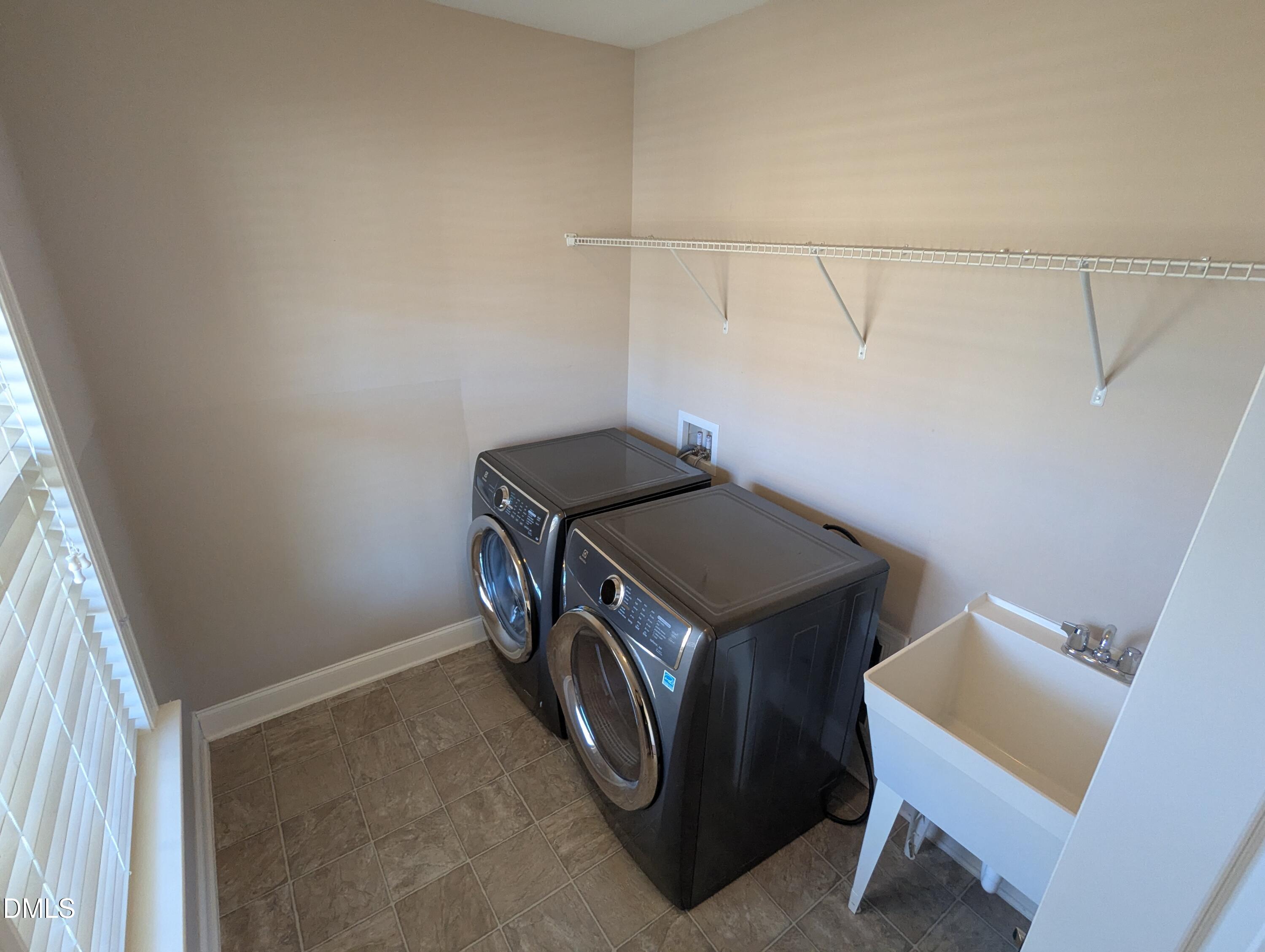 833 Poplar Street Durham, NC 27703 - Photo 18 of 20 a utility room with dryer and washer