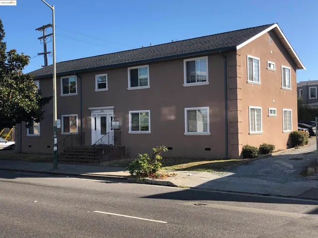 a front view of a house with yard