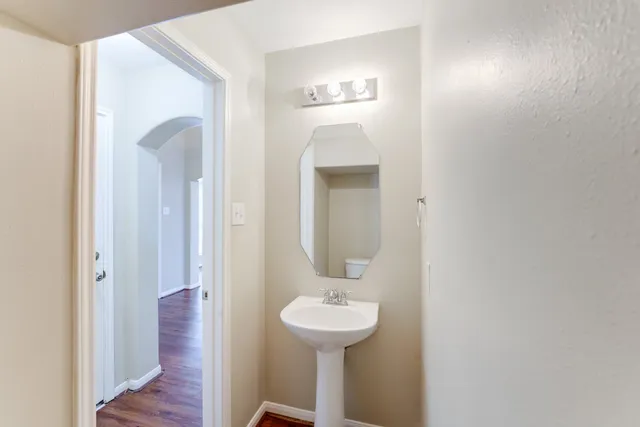 a bathroom with a sink and mirror