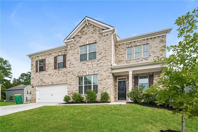 front view of a house with a yard