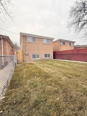 a house view with swimming pool in front of it