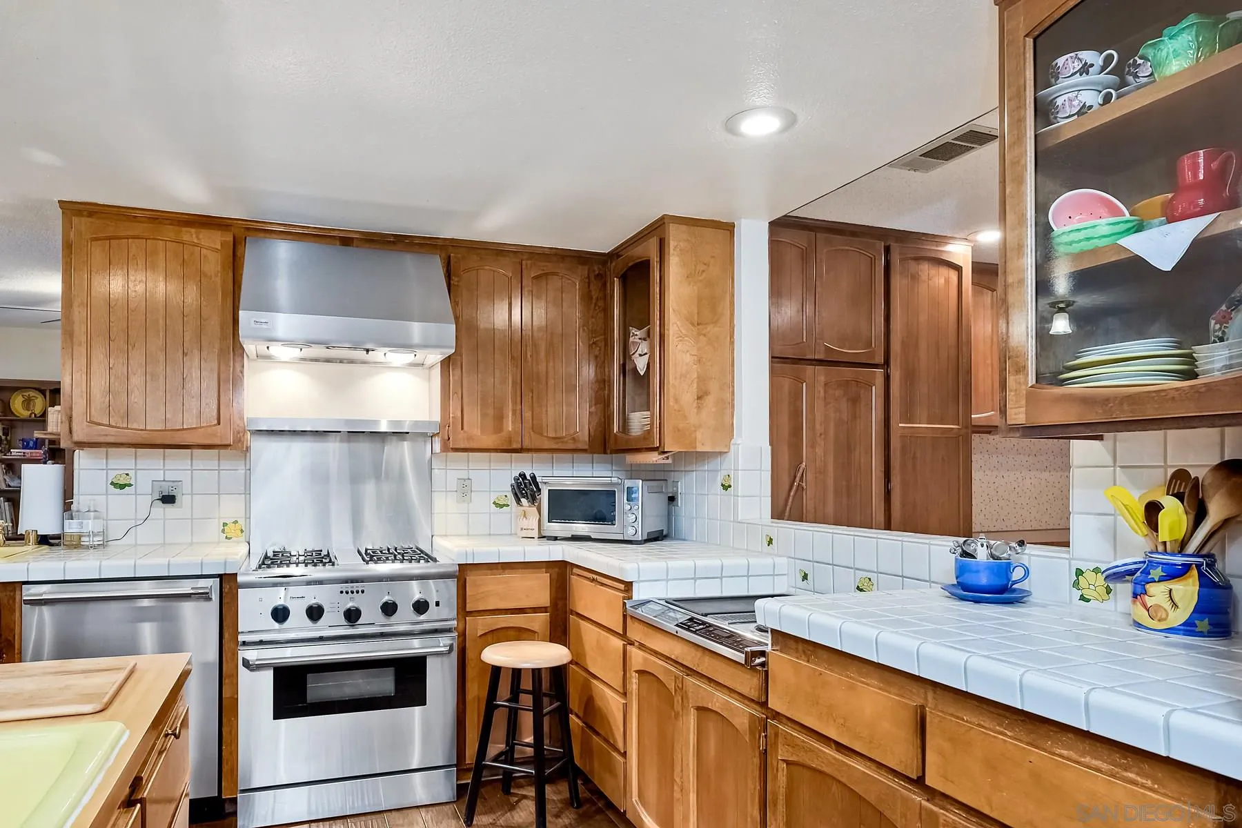 1828 Pine View Road Alpine, CA 91901 - Photo 22 of 53 a kitchen with stainless steel appliances granite countertop a sink stove and cabinets