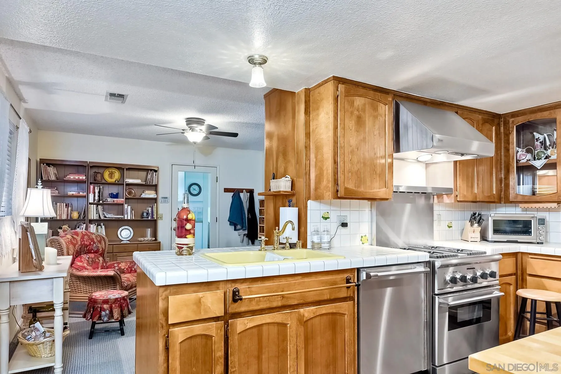 1828 Pine View Road Alpine, CA 91901 - Photo 23 of 53 a kitchen that has a lot of cabinets in it and wooden floors