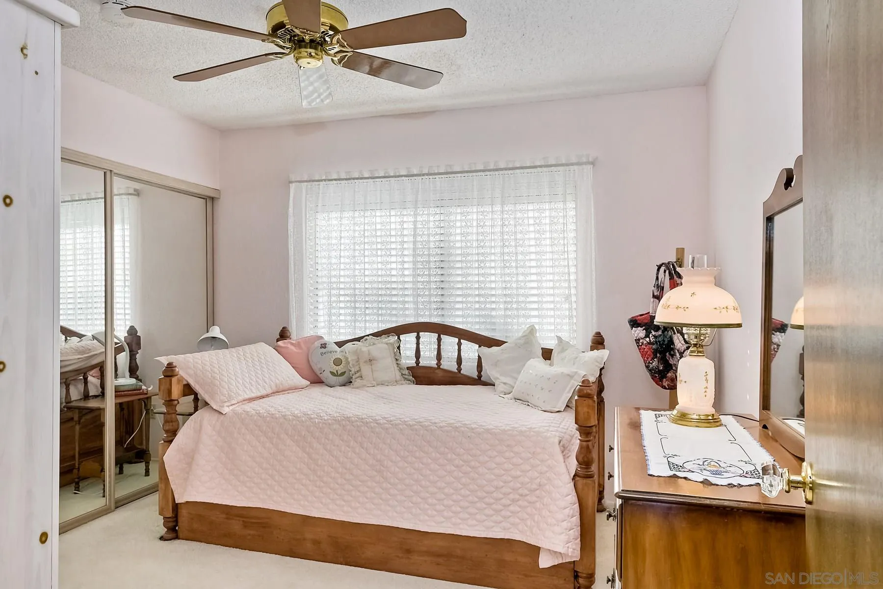 1828 Pine View Road Alpine, CA 91901 - Photo 27 of 53 a bedroom with a bed and wooden floor