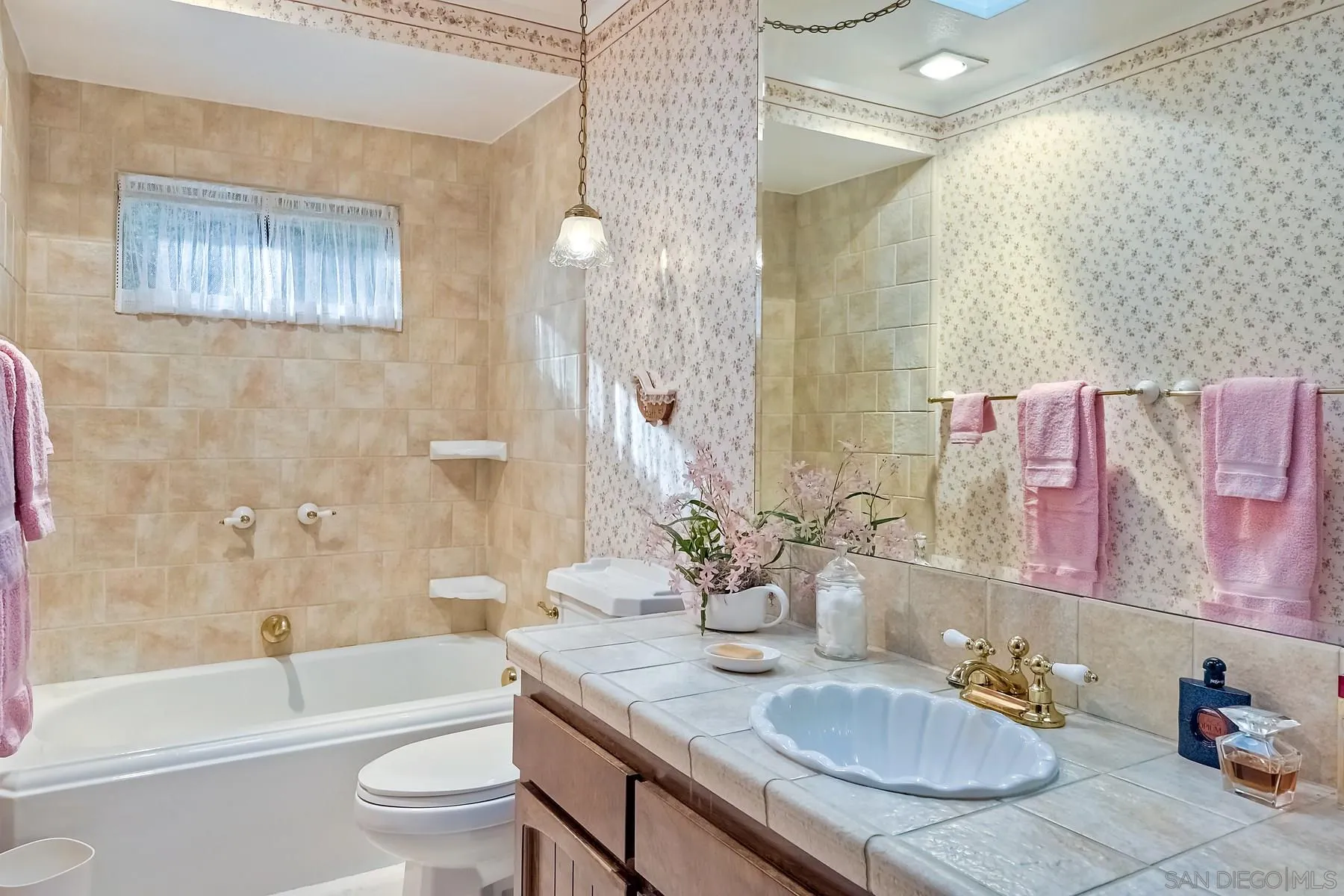 1828 Pine View Road Alpine, CA 91901 - Photo 28 of 53 a bathroom with a granite countertop sink a toilet a mirror a bathtub and shower