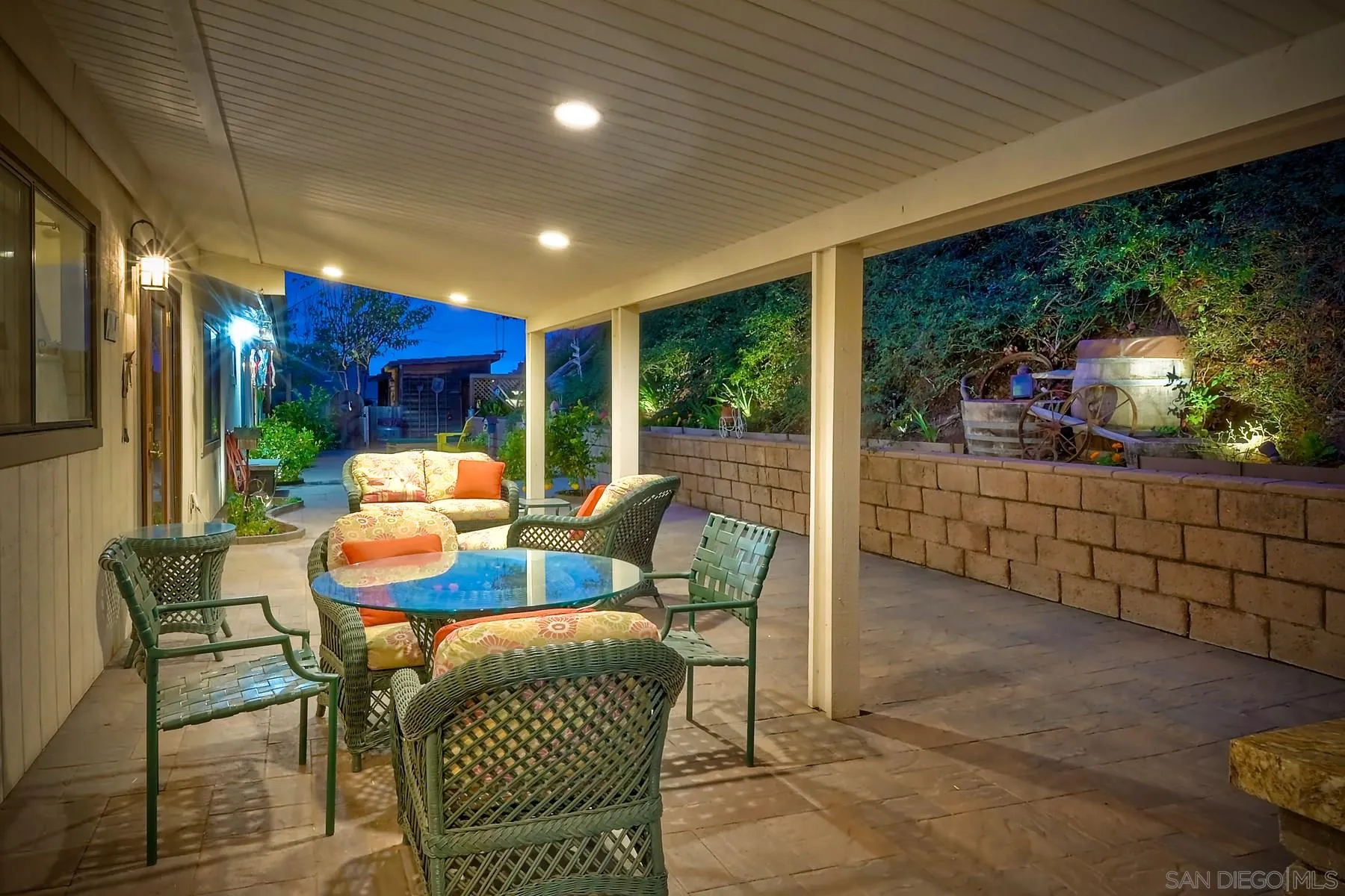 1828 Pine View Road Alpine, CA 91901 - Photo 37 of 53 a view of a patio with table and chairs with wooden floor and fence