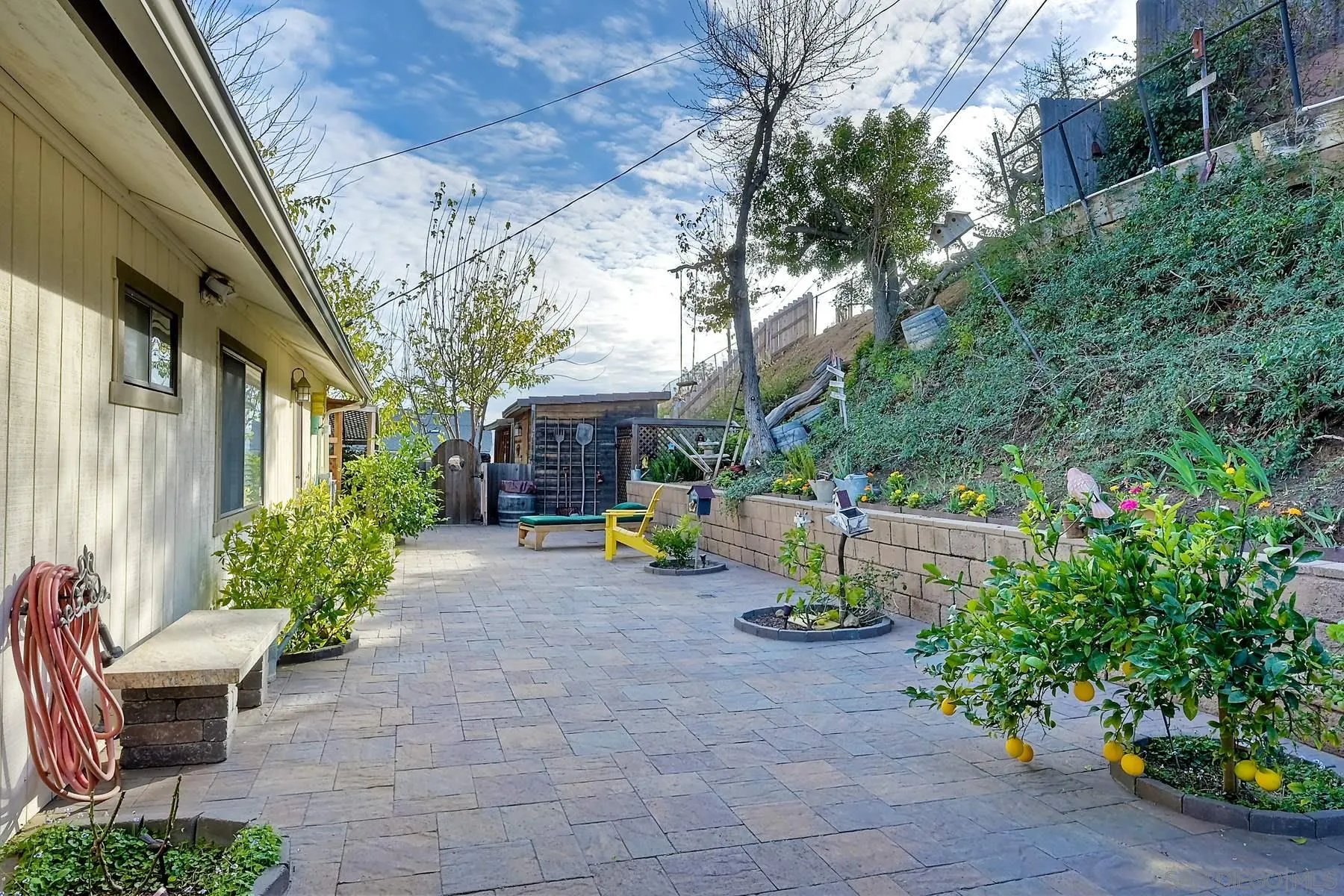 1828 Pine View Road Alpine, CA 91901 - Photo 46 of 53 a view of a patio with table and chairs potted plants with large tree