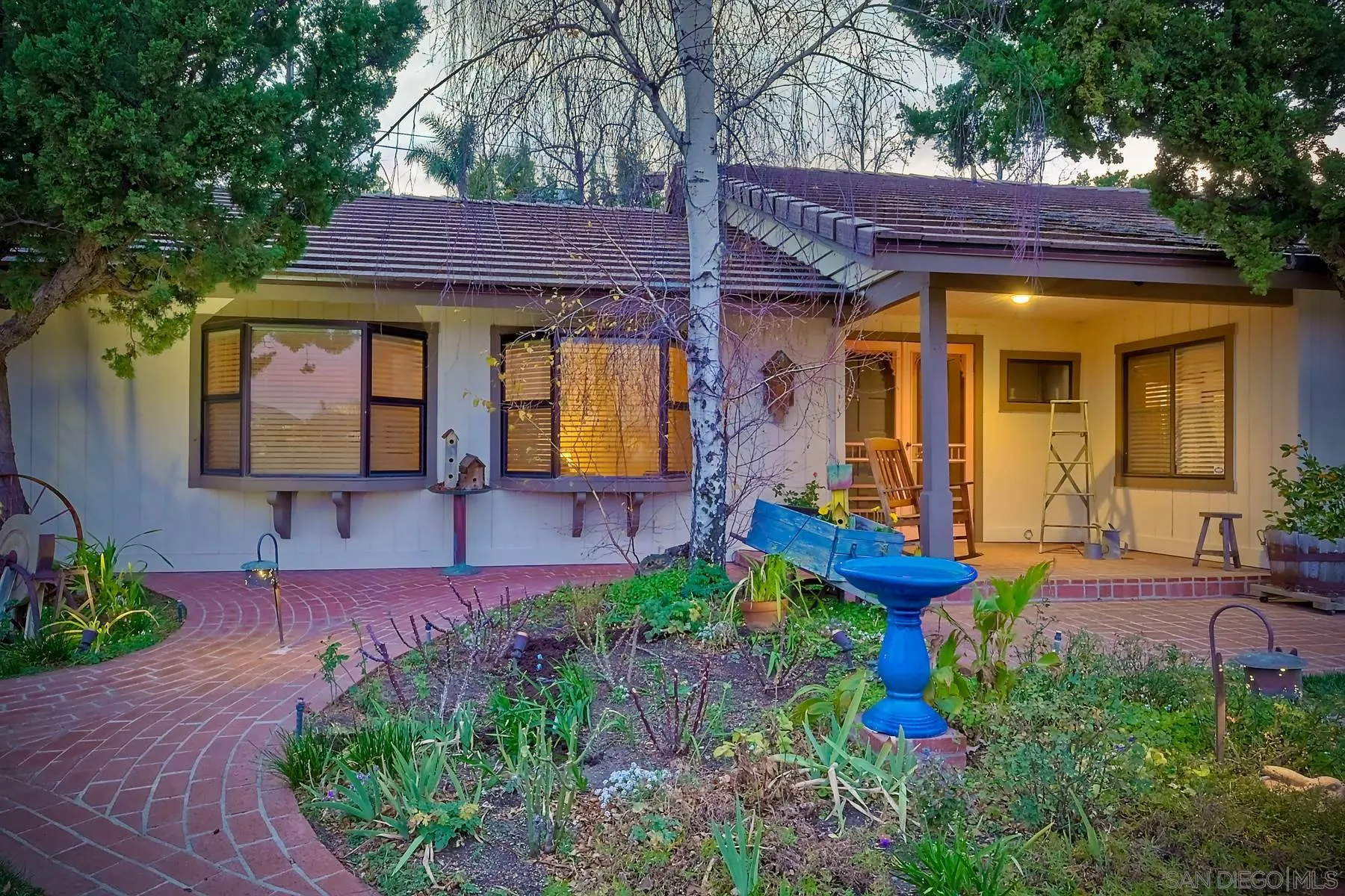 1828 Pine View Road Alpine, CA 91901 - Photo 50 of 53 a view of a house with table and chairs under an umbrella