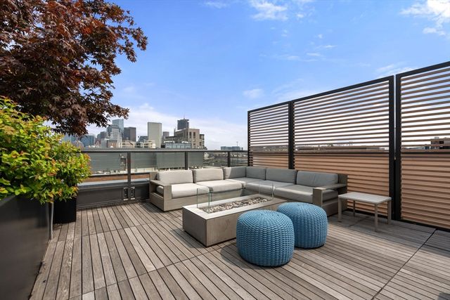 a building with potted plants in front of it