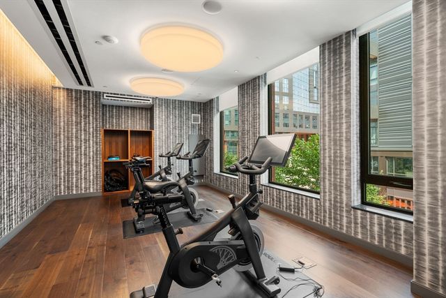 a bathroom with a shower and a mirror