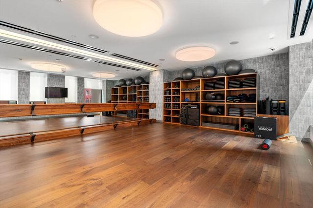a view of a house with potted plants
